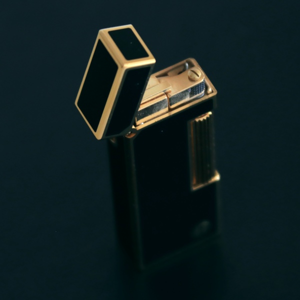 Black and gold electronic device on a dark background
