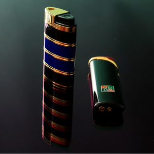 Two lighters, one tall and one compact, on a dark reflective surface.